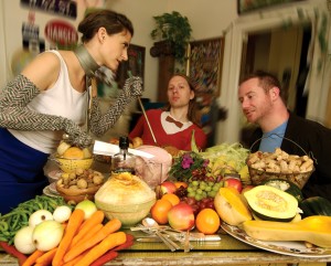 The original carve the ham photo: three people at a table laden with food.